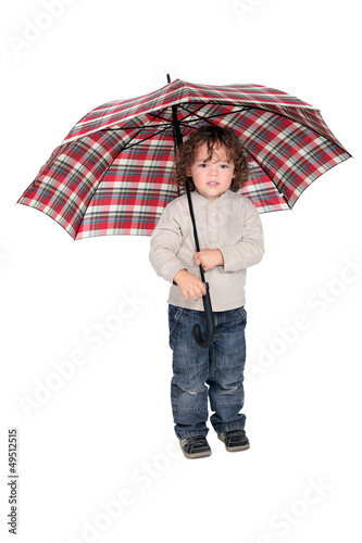 Photo: Young boy holding an open umbrella Young boy holding an open umbrella