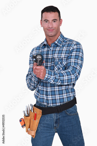 Photo: Worker with a drill Worker with a drill