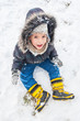 Little boy having fun on winter day