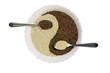 Eastern cuisine - sesame seeds in yin yang shape plate, isolated