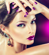 Beautiful fashion model in jewelery and lilaс  manicure