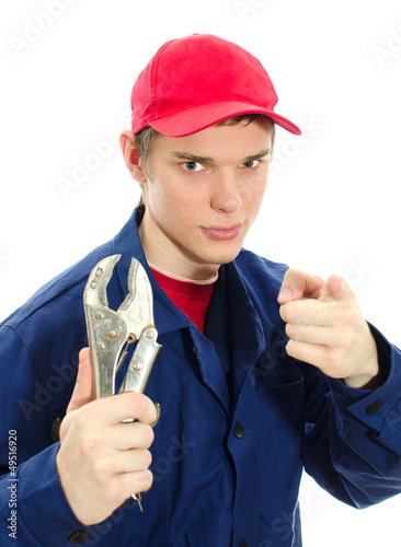 Photo: Young male plumber in uniform with wrench. Isolated on white Young male plumber in uniform with wrench. Isolated on white