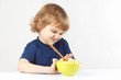 Little cute blonde boy refuses to eat a cereal