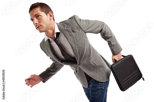 Photo: Young businessman walking. Isolated on white. Young businessman walking. Isolated on white.