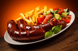 Grilled sausages, French fries and vegetables