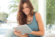Photo: Smiling Woman With Digital Tablet Smiling Woman With Digital Tablet