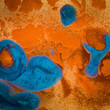 abstract orange and blue pigment backdrop