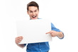 Young man pointing towards blank sign