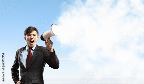 Photo: businessman with megaphone businessman with megaphone