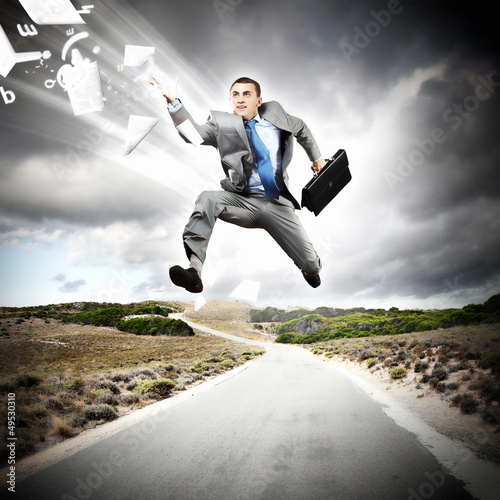 Photo: Businessman running on the road Businessman running on the road