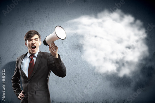 Photo: businessman with megaphone businessman with megaphone