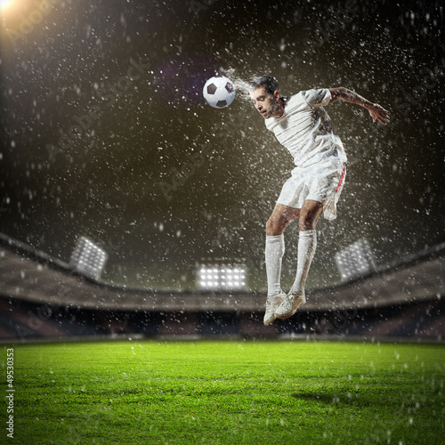 Photo: football player striking the ball football player striking the ball