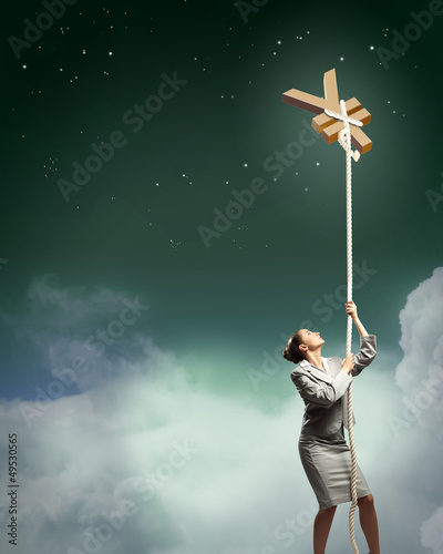 Photo: Image of businesswoman climbing the rope Image of businesswoman climbing the rope