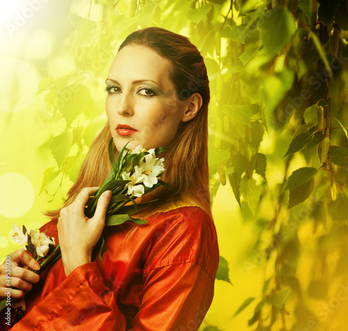 Photo: Beautiful woman with white flowers Beautiful woman with white flowers