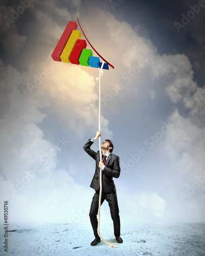 Photo: Image of businessman climbing rope Image of businessman climbing rope
