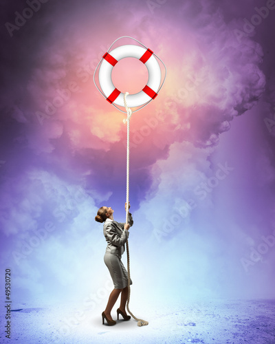 Photo: Image of businesswoman climbing the rope Image of businesswoman climbing the rope