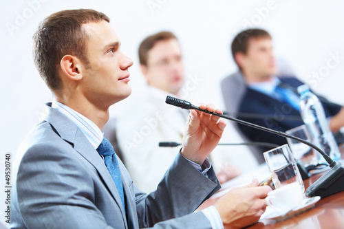 Photo: Three businesspeople at meeting Three businesspeople at meeting