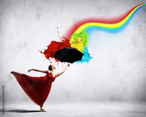 Photo: Ballet dancer in flying silk dress with umbrella Ballet dancer in flying silk dress with umbrella