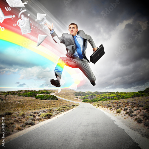 Photo: Businessman running on the road Businessman running on the road