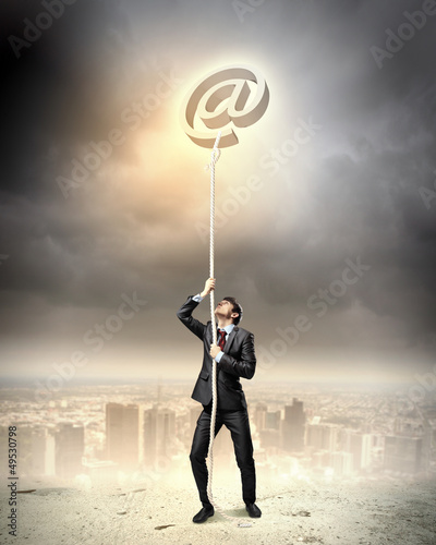 Photo: Image of businessman climbing rope Image of businessman climbing rope