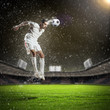 football player striking the ball