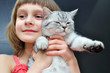 child with a cat