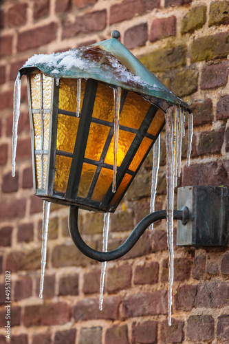 Photo: Antique lantern covered with icicles Antique lantern covered with icicles