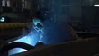 muhchina in the blue light from the welding