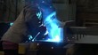 man working with metal at the plant