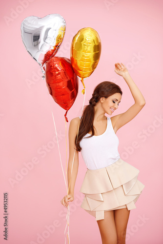 Photo: Dancing brunette with balloons Dancing brunette with balloons