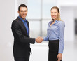 man and woman shaking their hands