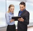 man and woman with tablet pc
