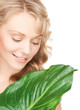 woman with green leaf
