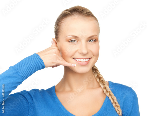 Photo: woman making a call me gesture woman making a call me gesture