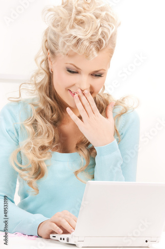 Photo: happy woman with laptop computer happy woman with laptop computer