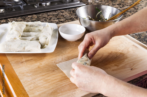 Photo: Creating homemade Chinese Spring Rolls in kitchen Creating homemade Chinese Spring Rolls in kitchen