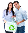 Couple recycling bottles