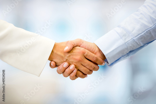 Photo: Business people handshaking Business people handshaking