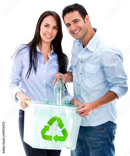 Photo: Couple recycling bottles Couple recycling bottles