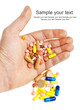 Hand with colorful pills