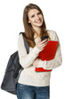 Woman student with backpack sending sms on cell phone