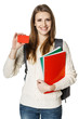 Woman student holding textbooks showing blank credit card