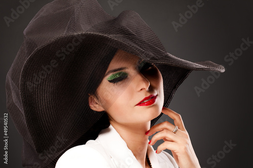 Photo: Retro style woman with bright makeup Retro style woman with bright makeup