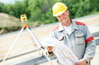 surveyor works with theodolite