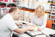 Seller and buyer selecting paint color
