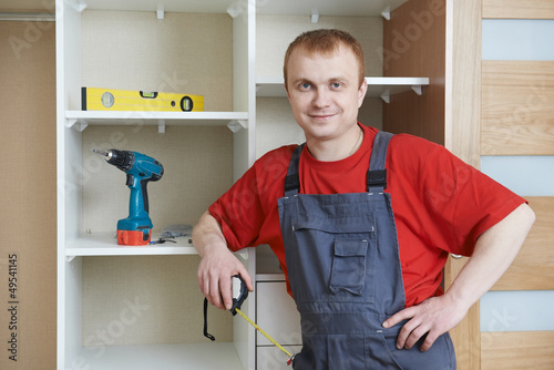 Photo: Portrait of wardrobe installation joiner Portrait of wardrobe installation joiner
