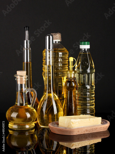 Photo: Different types of oil on dark background Different types of oil on dark background