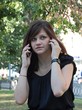 Girl speaking on two mobile phones