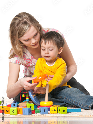 Photo: Mother and son on the floor with toys Mother and son on the floor with toys