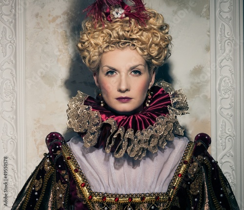 Photo: Haughty queen in royal dress Haughty queen in royal dress